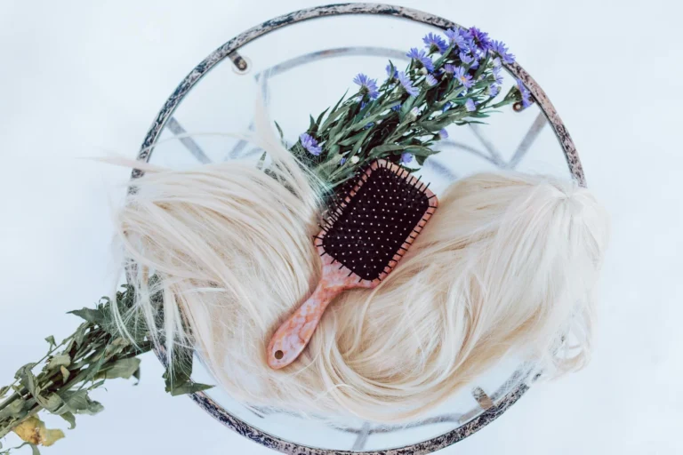 black and white hair brush on white and green floral wreath